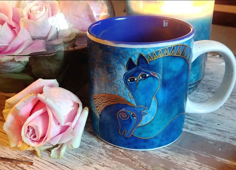Image of pink roses with a Laurel Burch coffee mug with two horses